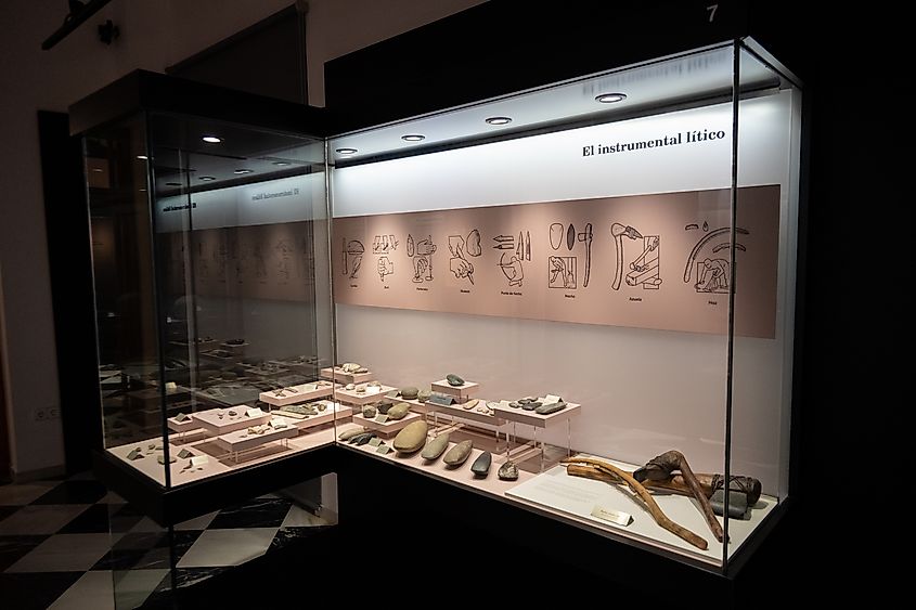  Display of prehistoric stone tools in glass casing at the Museo Arqueologico Municipal de Jerez de la Frontera, Spain.