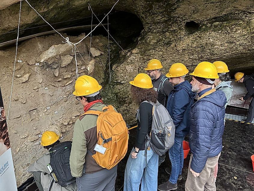 Tourists visiting Fumane Cave in 2025